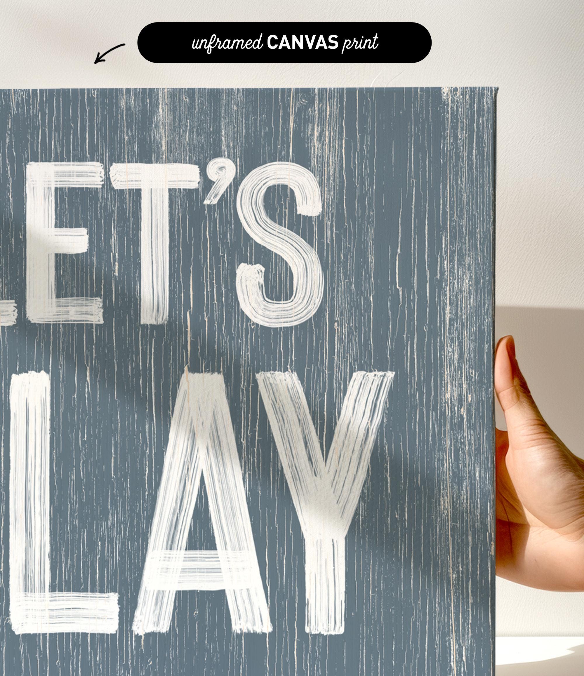 a hand holding a sign that says let&#39;s play