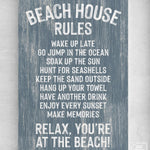 Add a coastal vibe to your decor with the Beach House Rules Sign, Painted Wood, Harbor Blue—a charming blue wooden sign with playful white text and "Relax, you're at the beach!" at the end.
