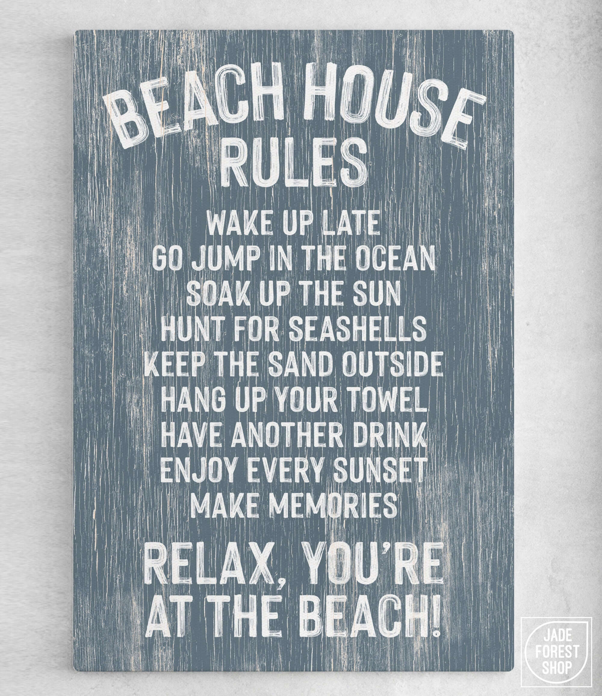 Add a coastal vibe to your decor with the Beach House Rules Sign, Painted Wood, Harbor Blue—a charming blue wooden sign with playful white text and "Relax, you're at the beach!" at the end.