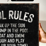 a hand holding a sign that says oil rules