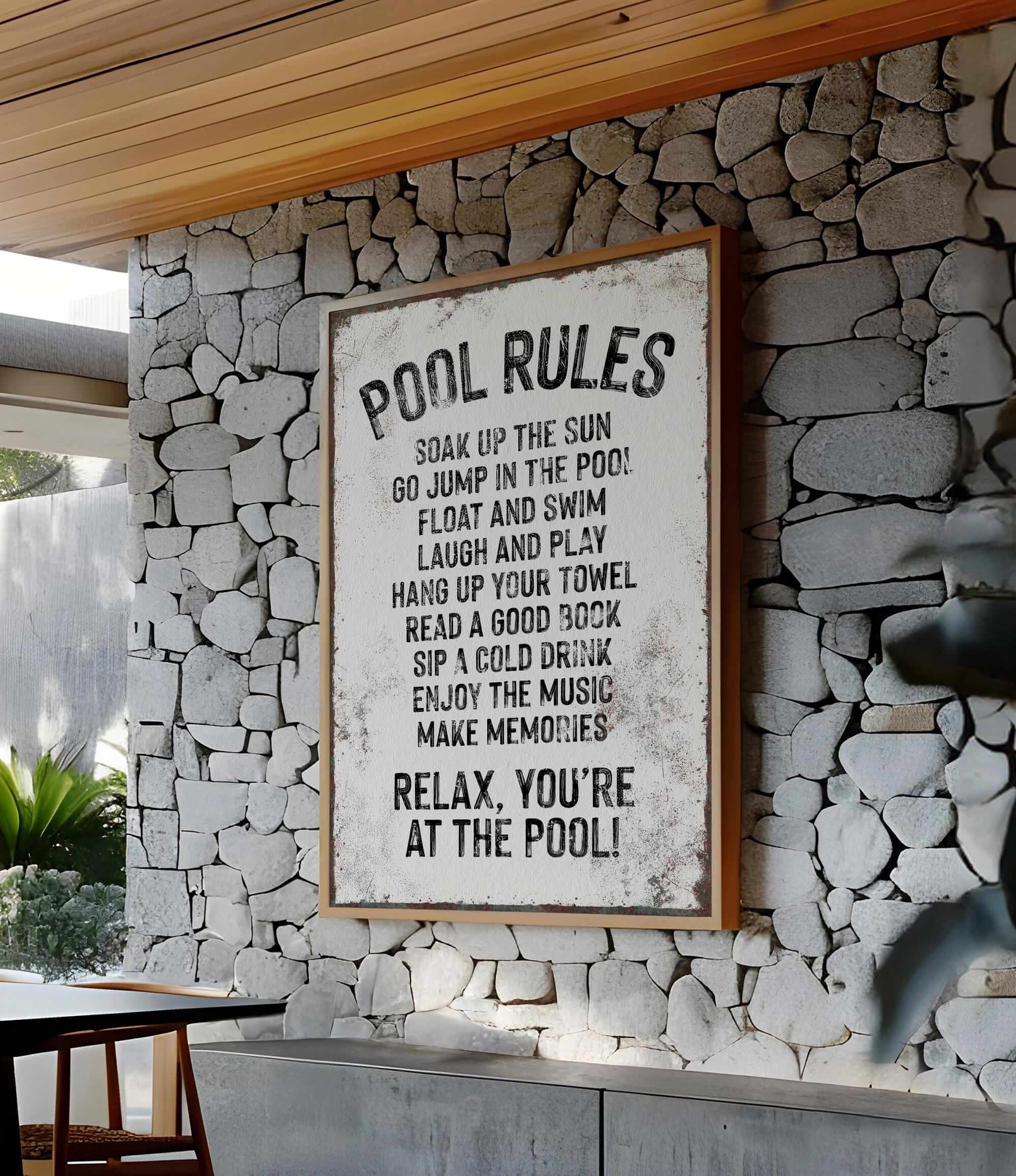 a sign on a stone wall that says pool rules