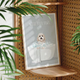 A framed poster with a dog sitting in a bathtub, surrounded by plants, with the text "WASH YOUR PAWS" displayed prominently.