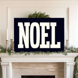 a fireplace with a sign that says noel on it