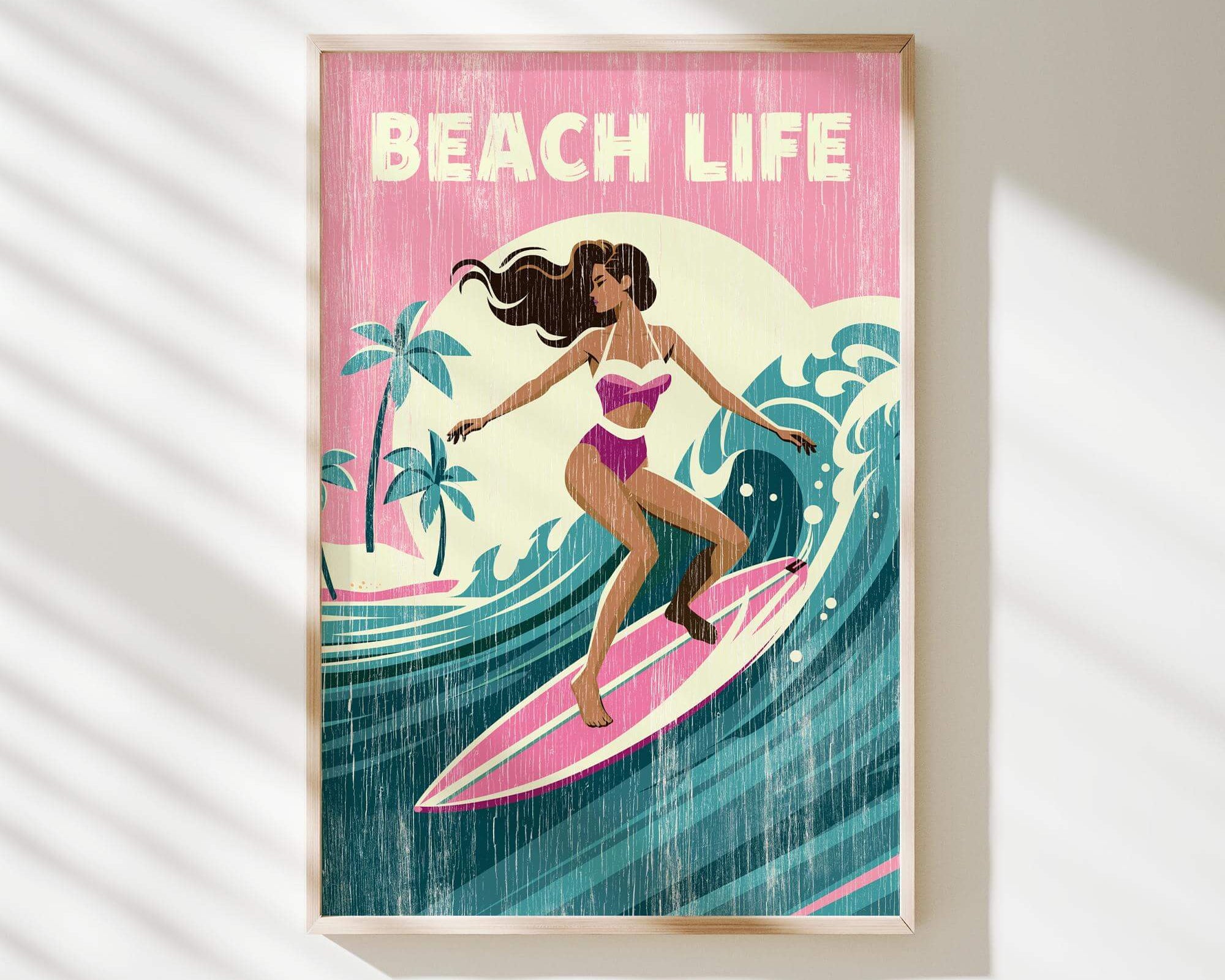 A framed illustration of a woman surfing on a wave, with the text "BEACH LIFE" prominently displayed.