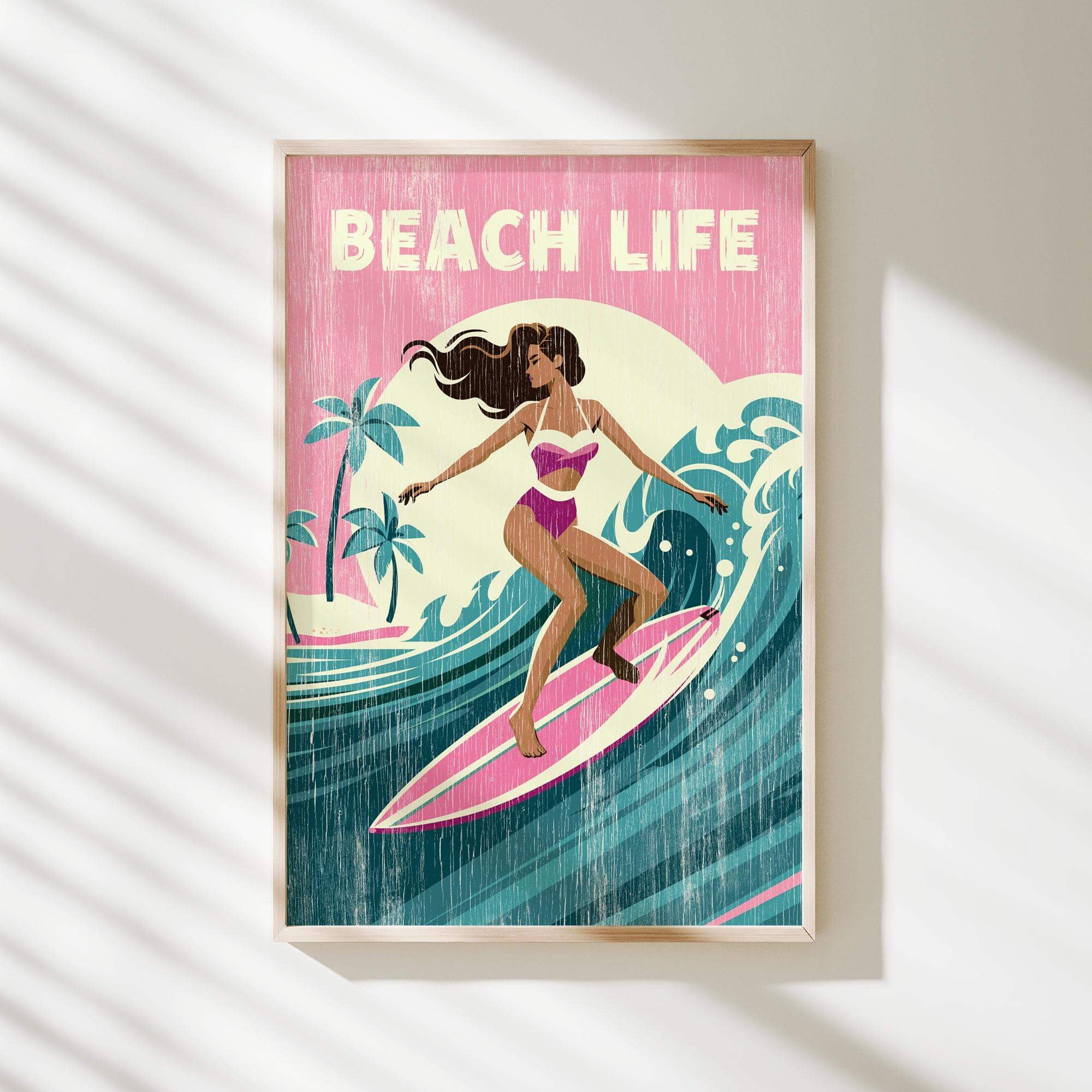 A framed illustration of a woman surfing on a wave, with the text "BEACH LIFE" prominently displayed.