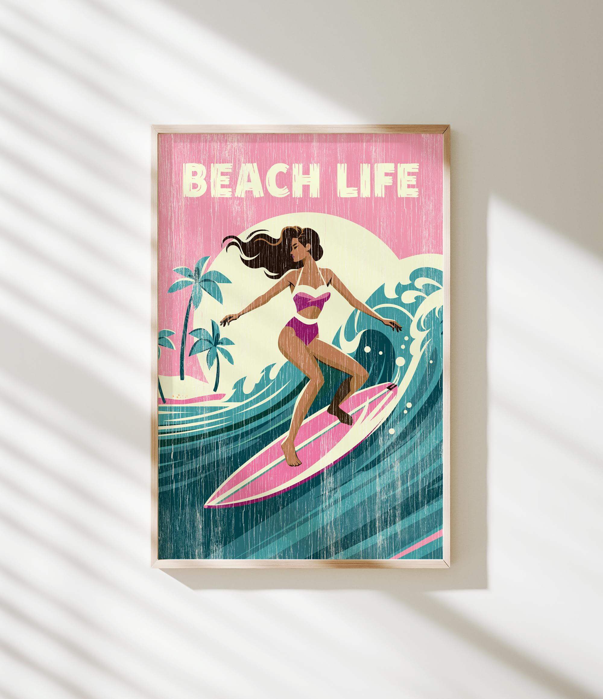 A framed illustration of a woman surfing on a wave, with the text "BEACH LIFE" prominently displayed.