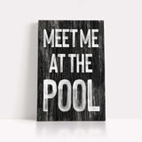 a wooden sign that says meet me at the pool