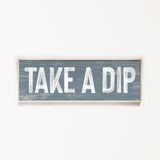 a wooden sign that says take a dip