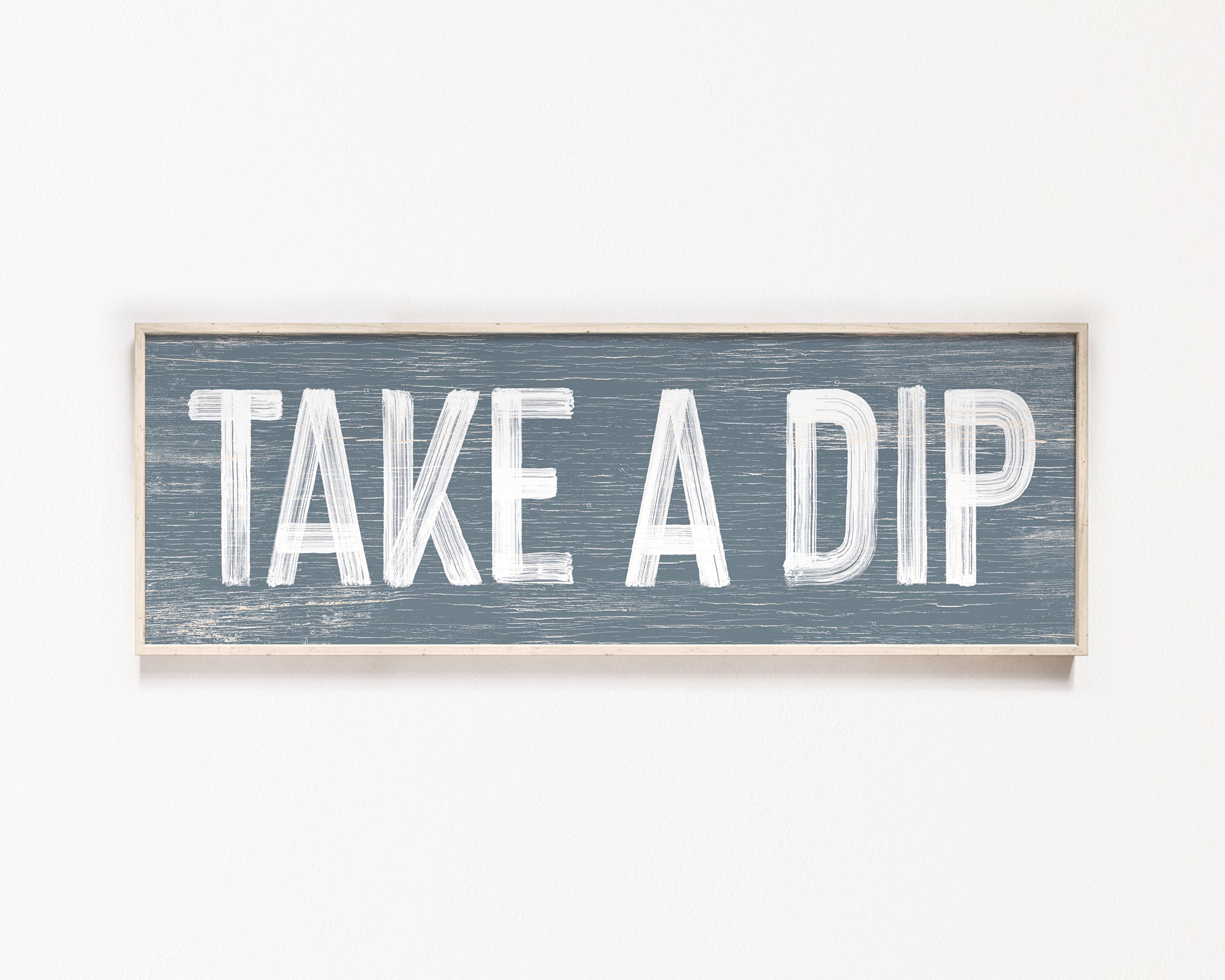 a wooden sign that says take a dip