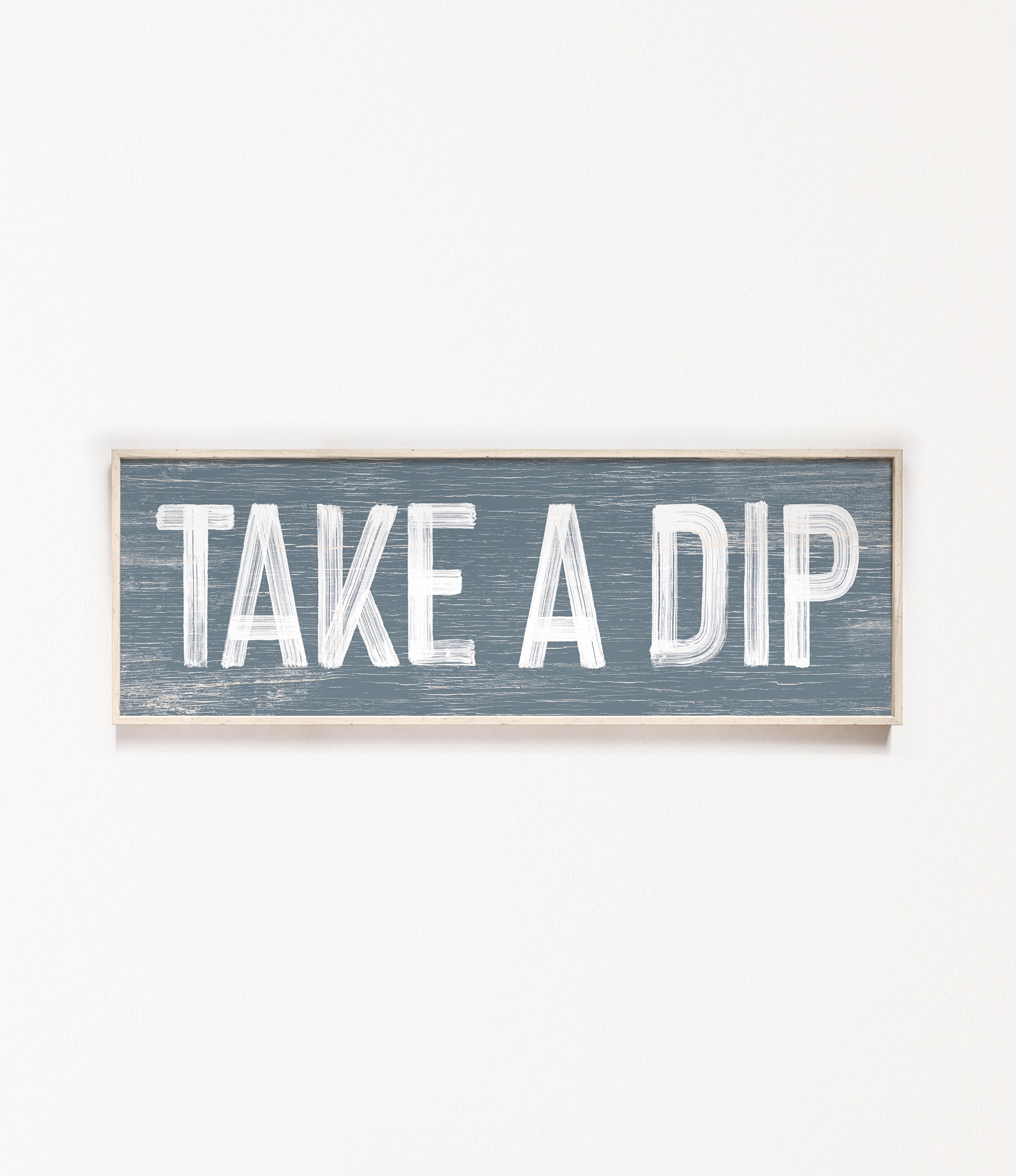 a wooden sign that says take a dip