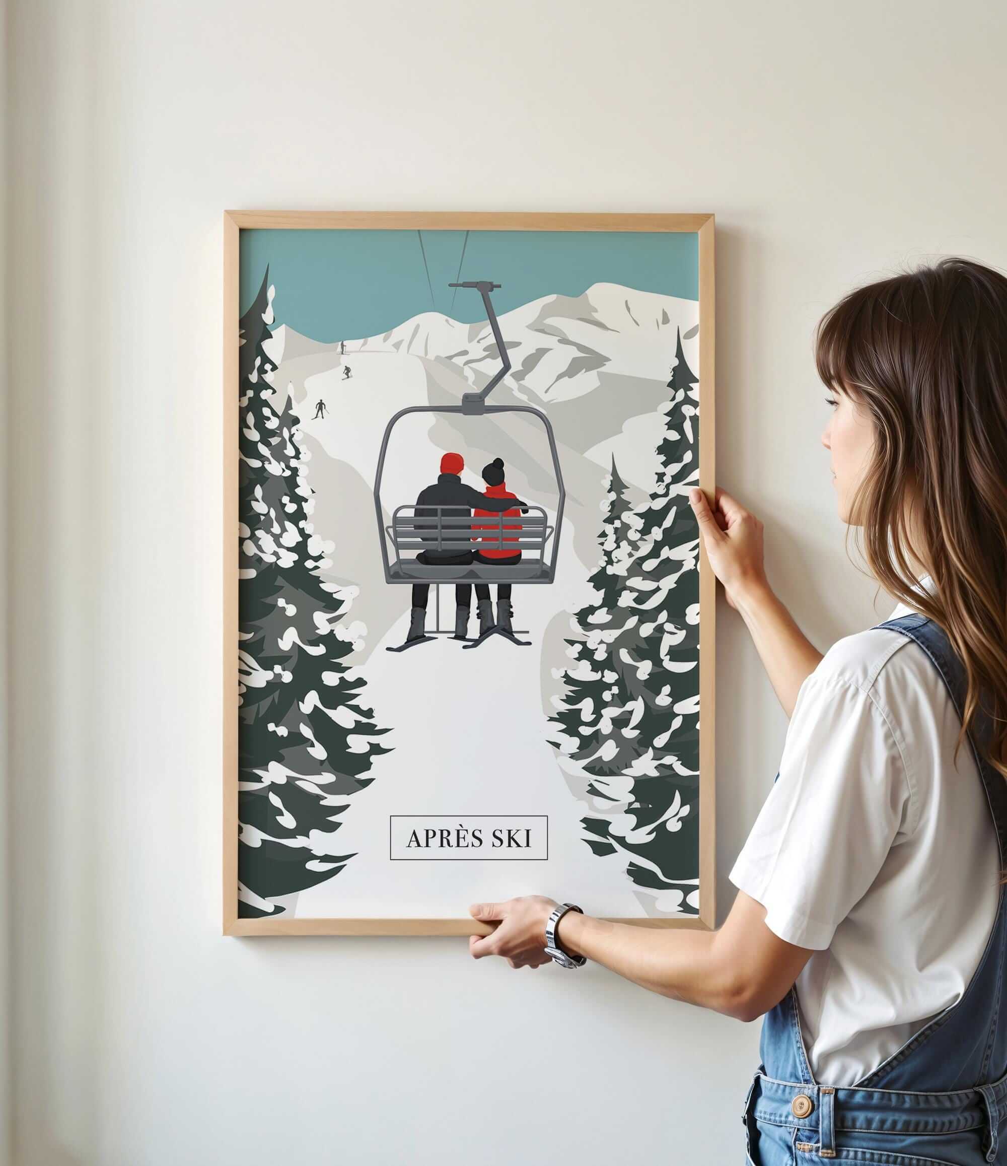 A woman is standing in front of a framed poster depicting a ski lift with two people riding it.