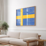 a living room with a white couch and a yellow and blue painting on the wall