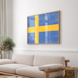 a living room with a white couch and a yellow and blue painting on the wall