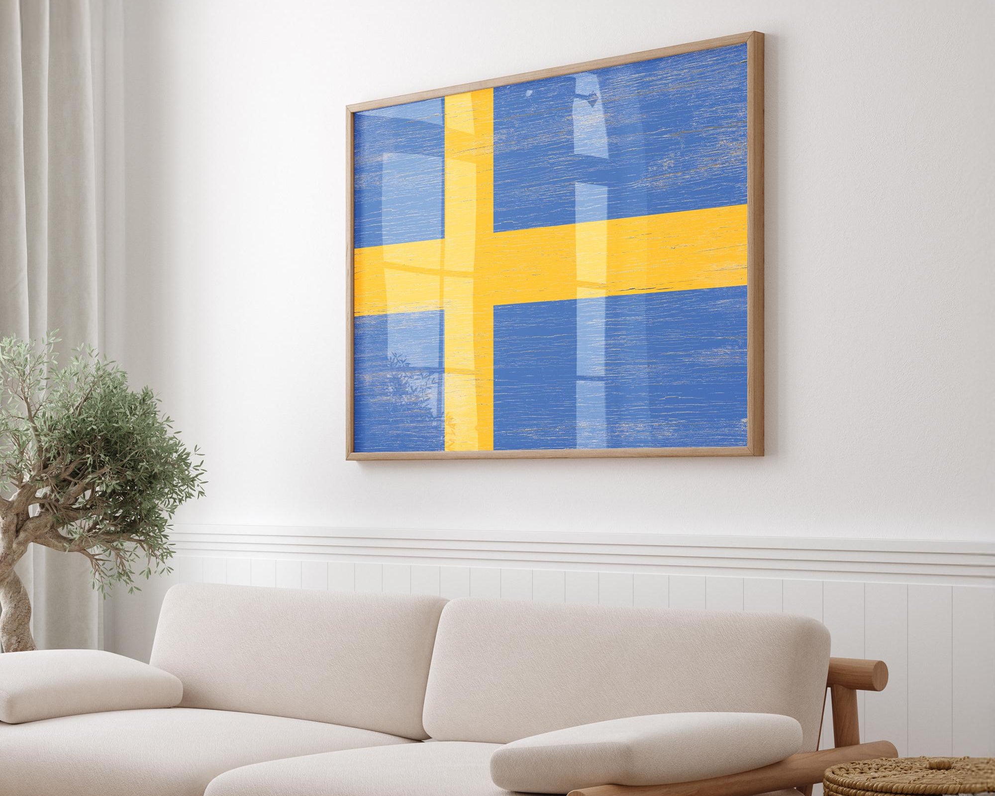 a living room with a white couch and a yellow and blue painting on the wall