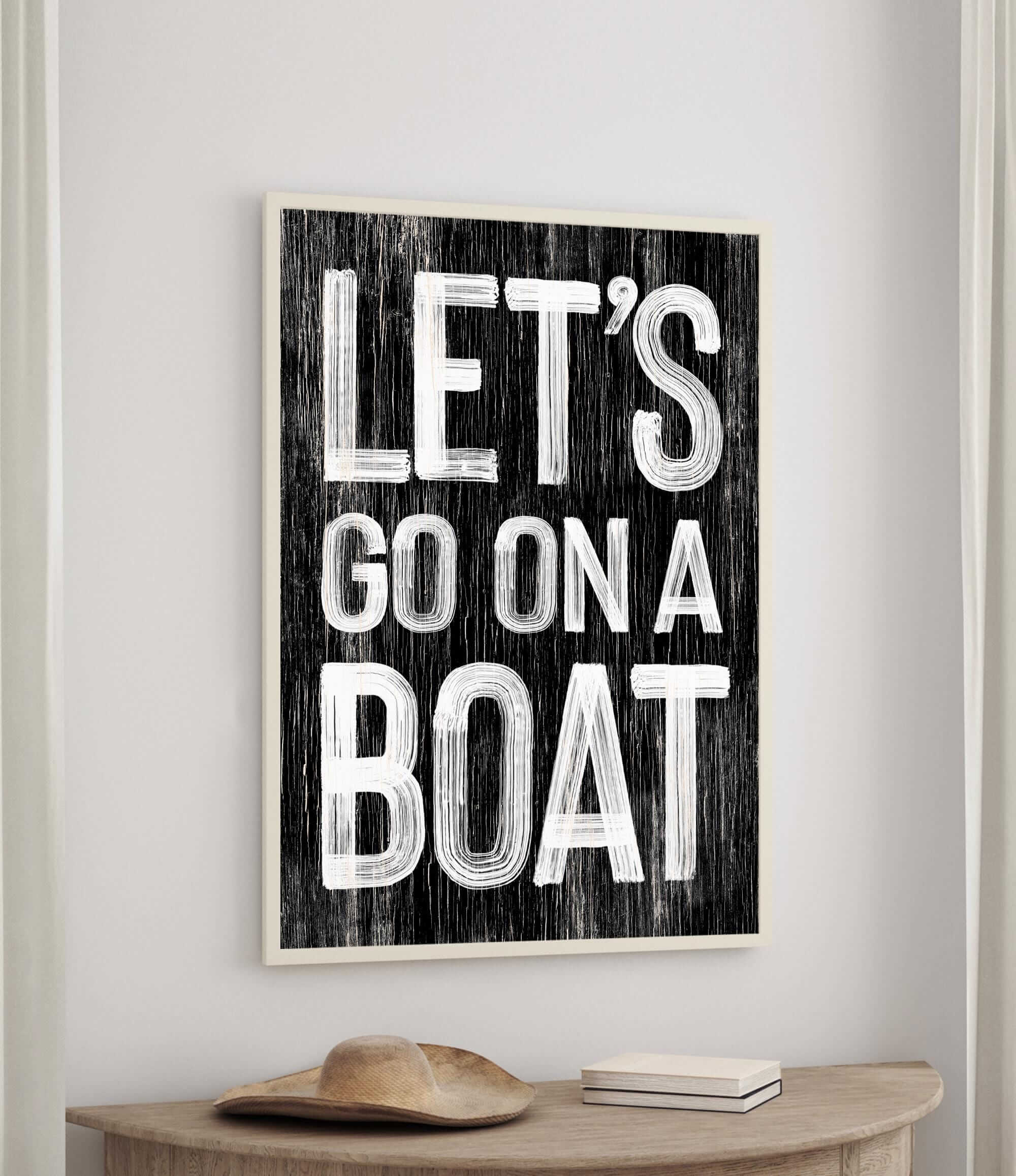 a black and white sign that says let&#39;s go on a boat