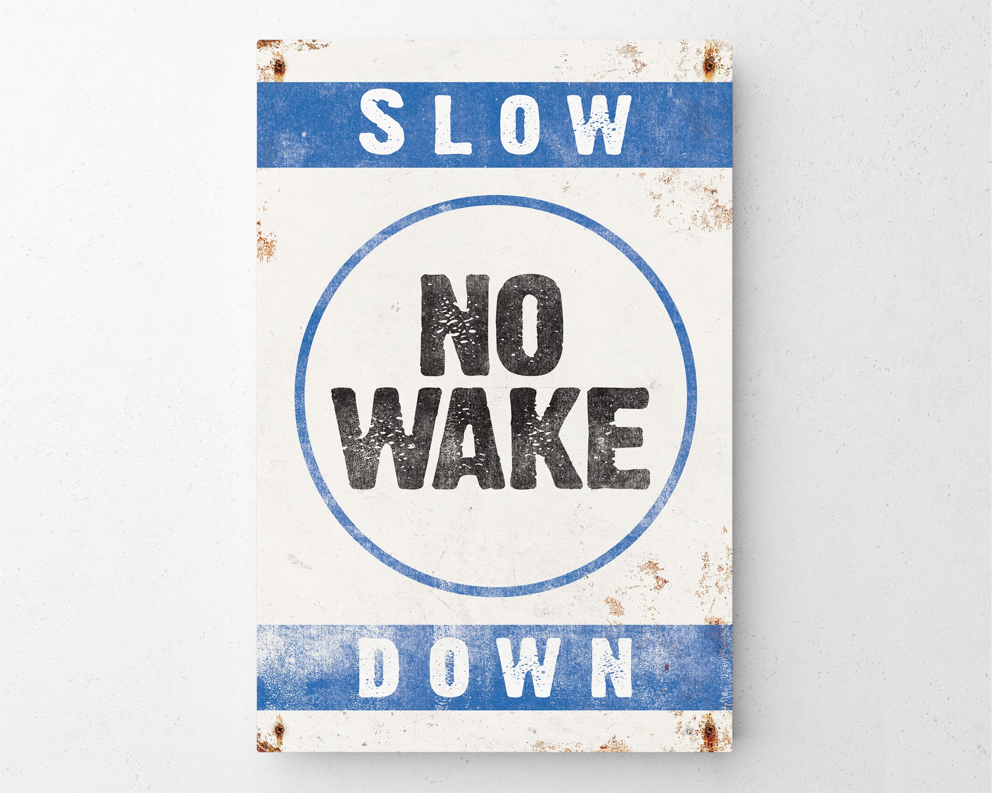 a sign that says slow no wake down