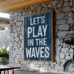 a sign that reads let&#39;s play in the waves