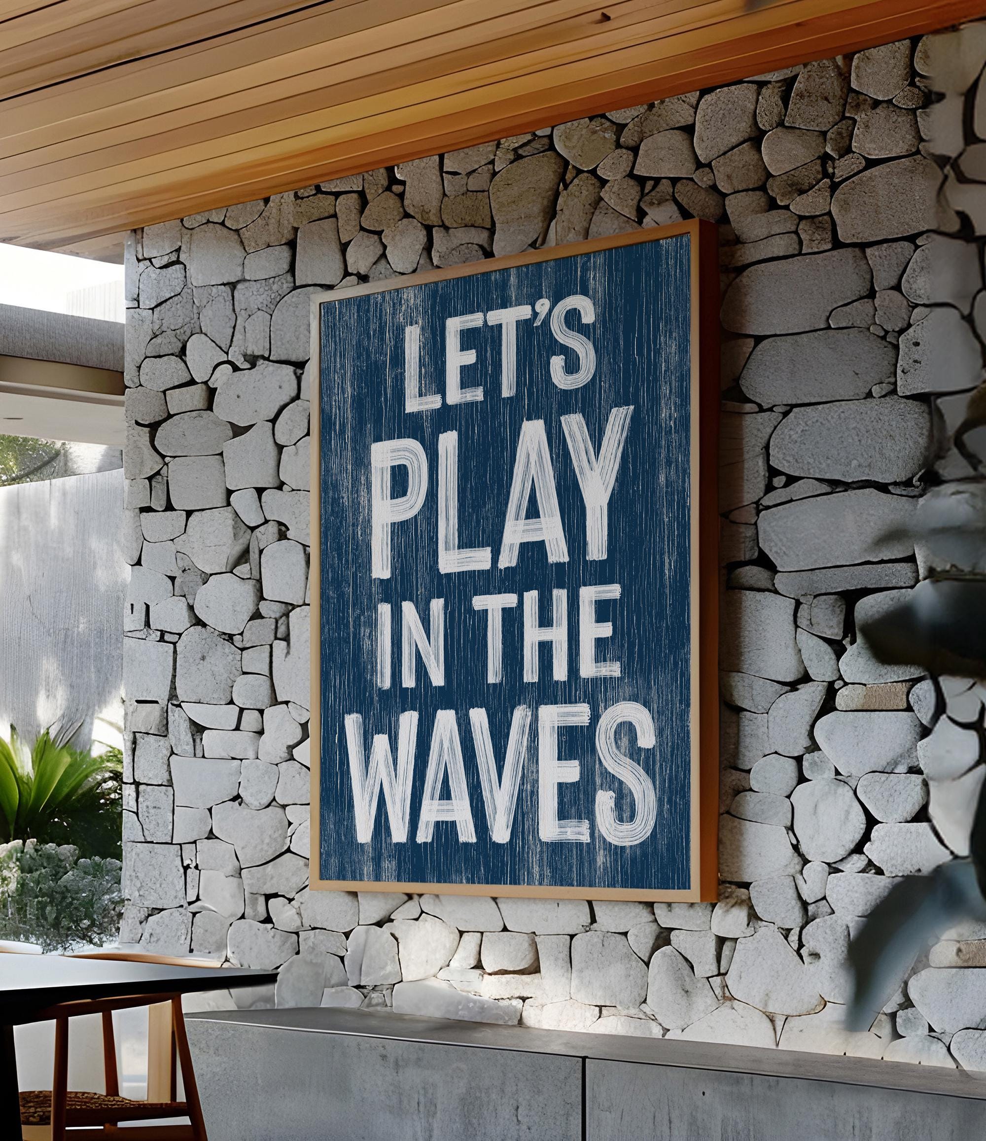 a sign that reads let&#39;s play in the waves