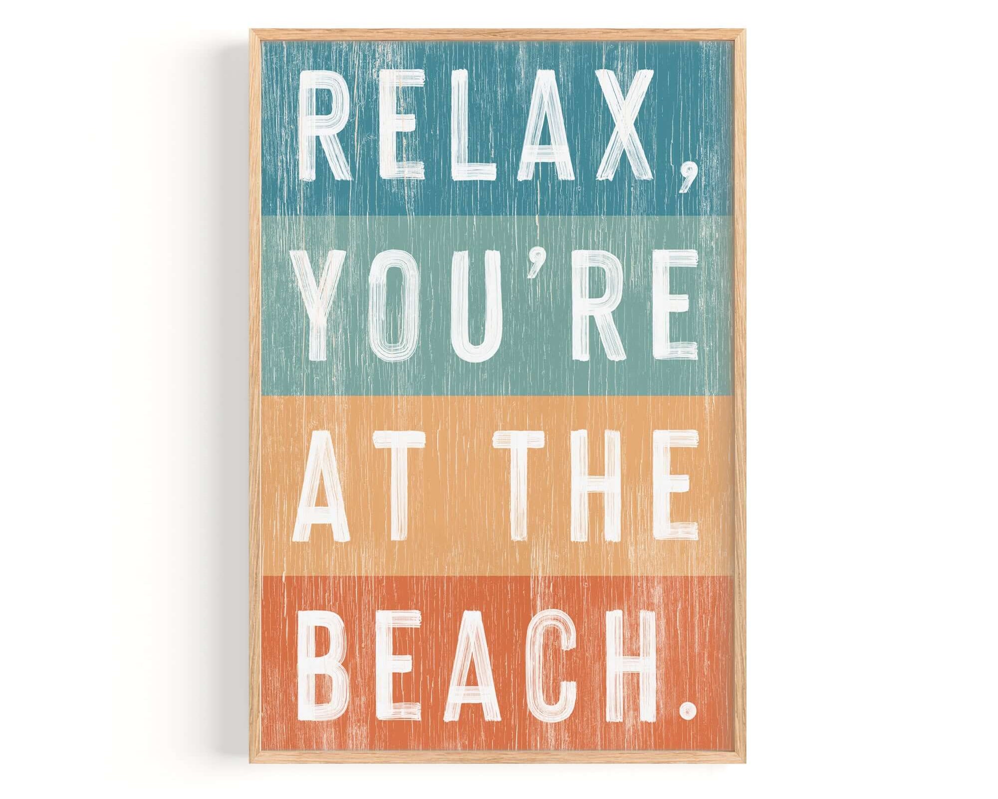 a wooden sign that says relax you're at the beach