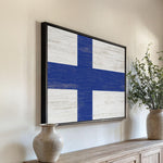 a painting of a blue and white cross on a wall