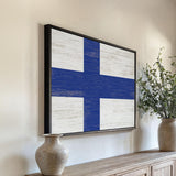 a painting of a blue and white cross on a wall