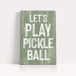 a wooden sign that says let's play pickle ball