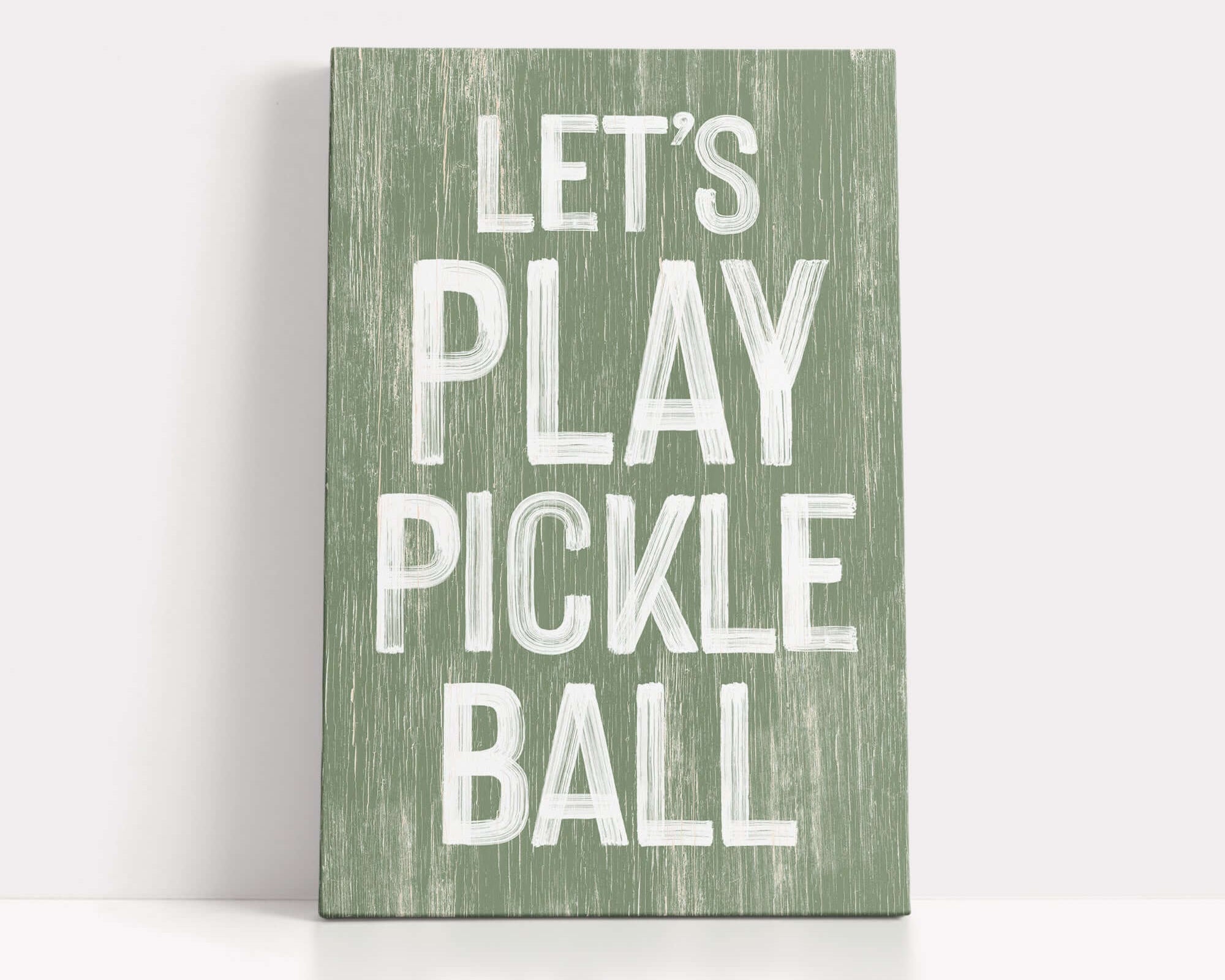 a wooden sign that says let's play pickle ball