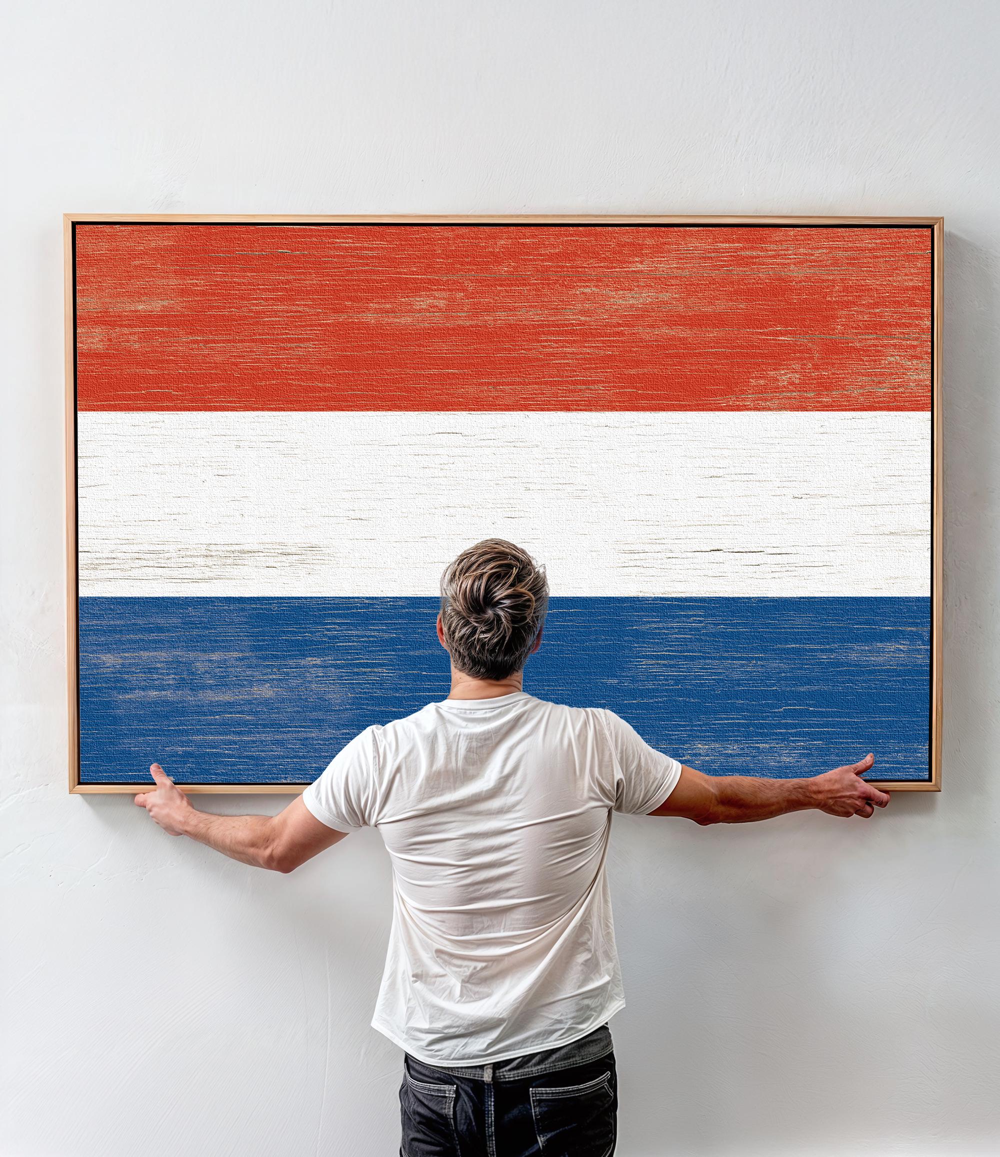 a man standing in front of a painting of the dutch flag