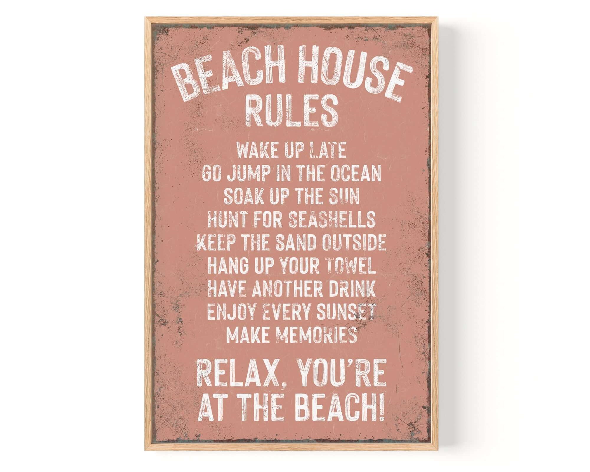 The Beach House Rules Sign features fun beach activities on a distressed coral background with rusted edges—perfect vintage home decor to add retro wall decor charm to any space.