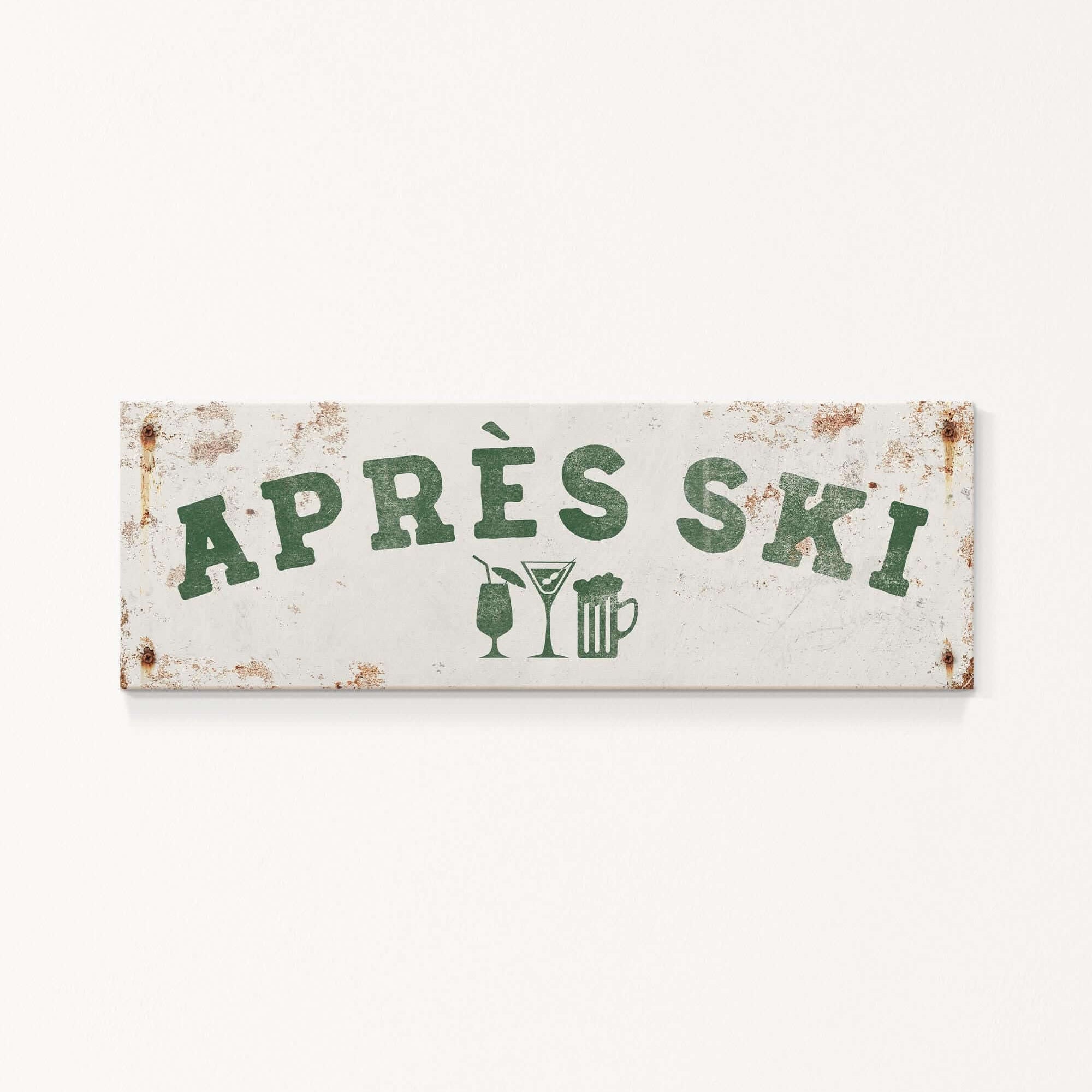 A weathered sign with the text "APRES SKI" in green letters, along with icons of a beer glass and a martini glass, indicating a location or establishment related to skiing and alcoholic beverages.