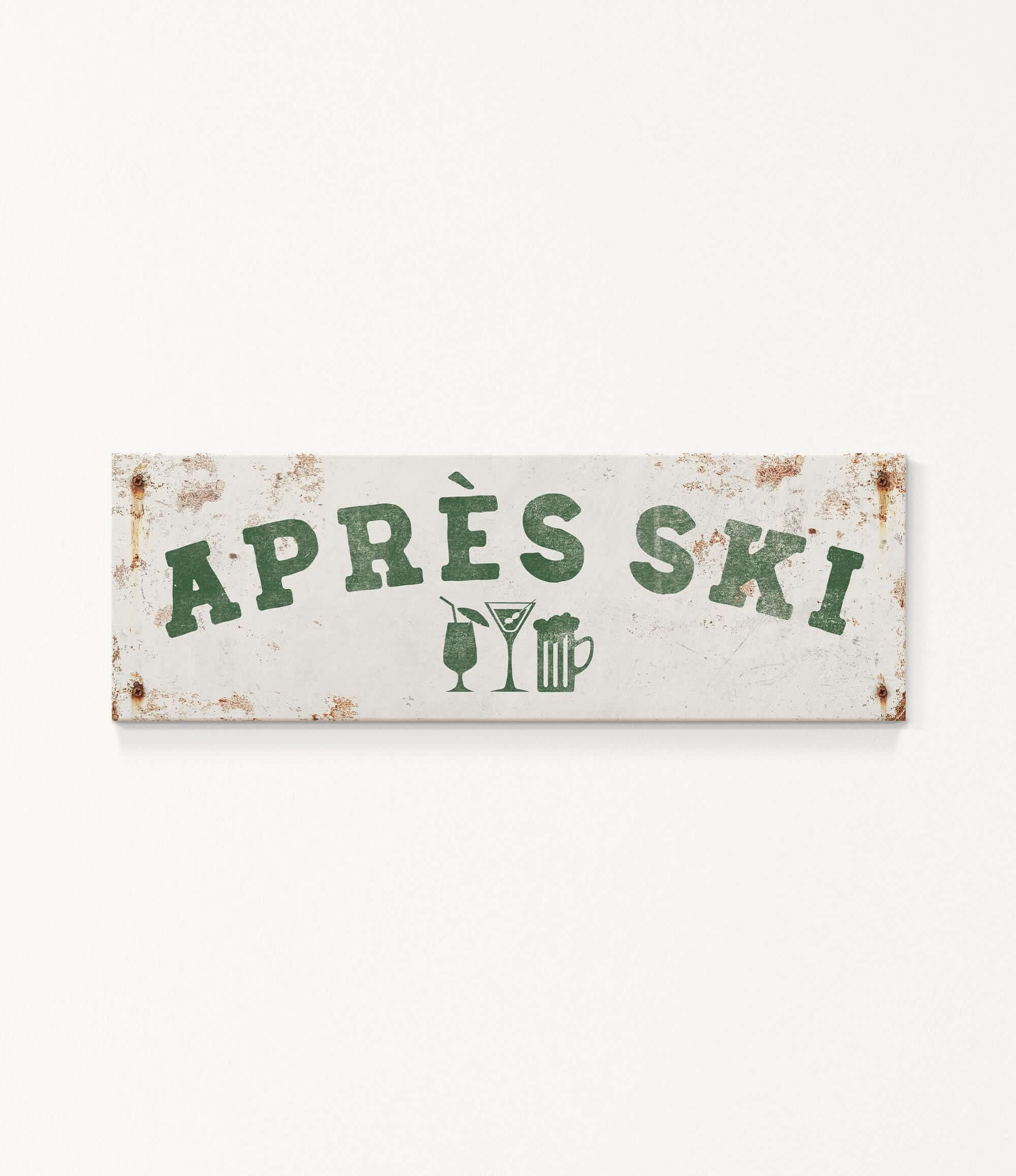 A weathered sign with the text "APRES SKI" in green letters, along with icons of a beer glass and a martini glass, indicating a location or establishment related to skiing and alcoholic beverages.
