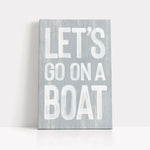 a wooden sign that says let&#39;s go on a boat