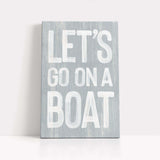 a wooden sign that says let&#39;s go on a boat