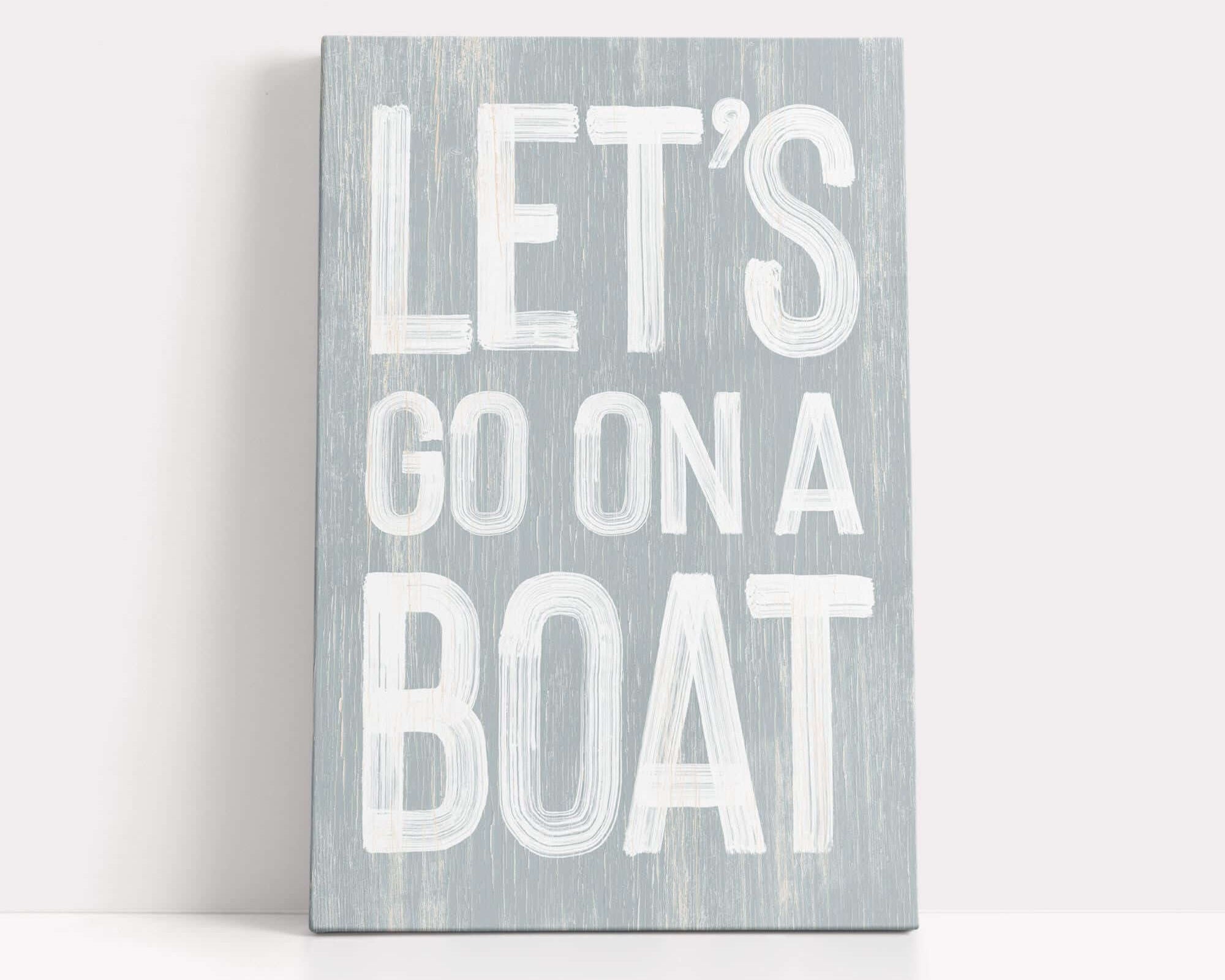 a wooden sign that says let's go on a boat