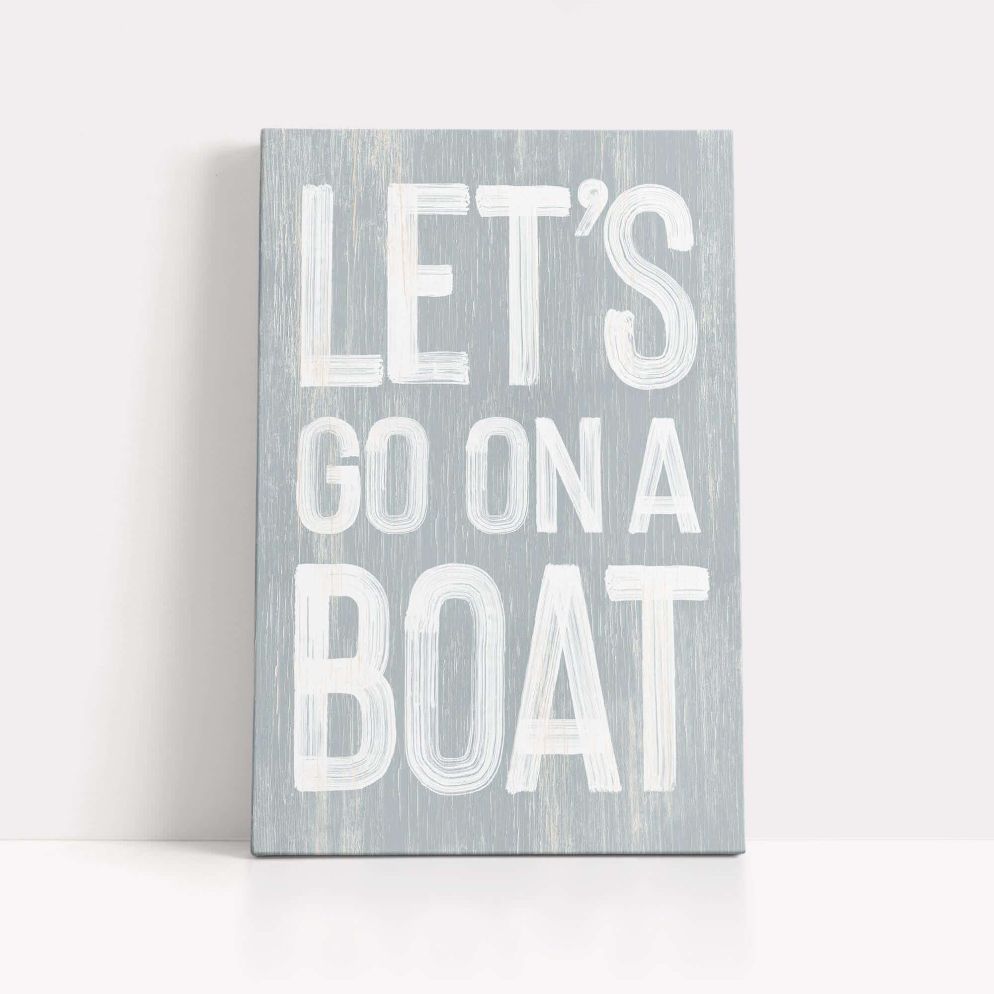 a wooden sign that says let's go on a boat