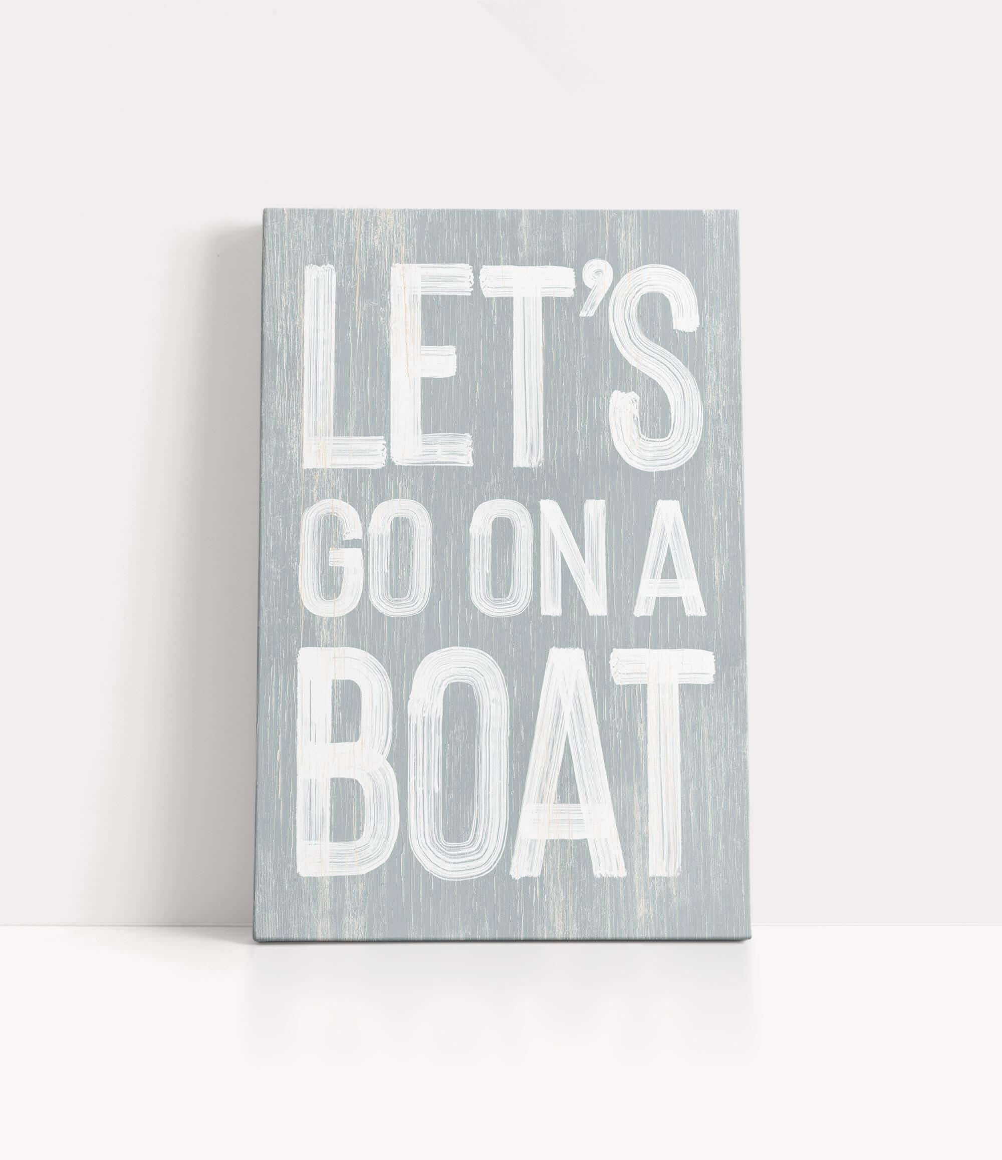 a wooden sign that says let&#39;s go on a boat