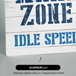a sign that reads wake zone idle speed