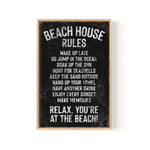 a black and white sign that says beach house rules