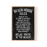 a black and white sign that says beach house rules