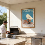 A man grilling food on a barbecue in an outdoor kitchen area with a framed poster above the grill.
