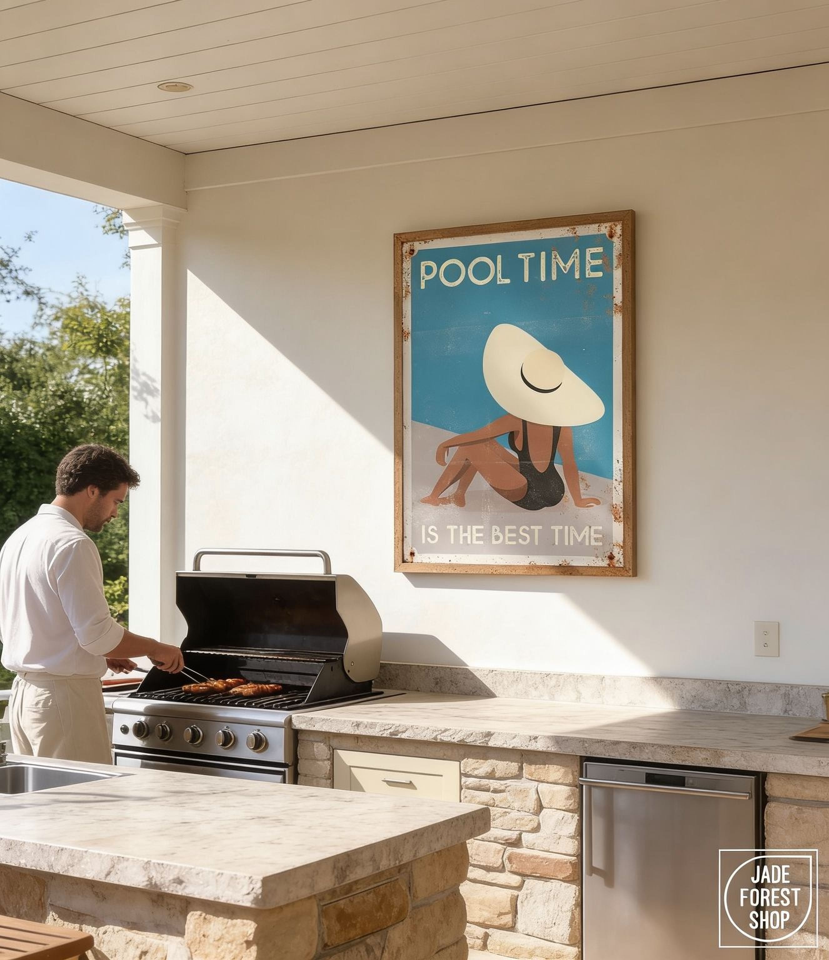 A man grilling food on a barbecue in an outdoor kitchen area with a framed poster above the grill.