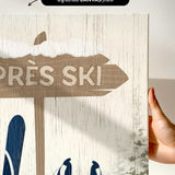 a hand holding a sign that says tres ski