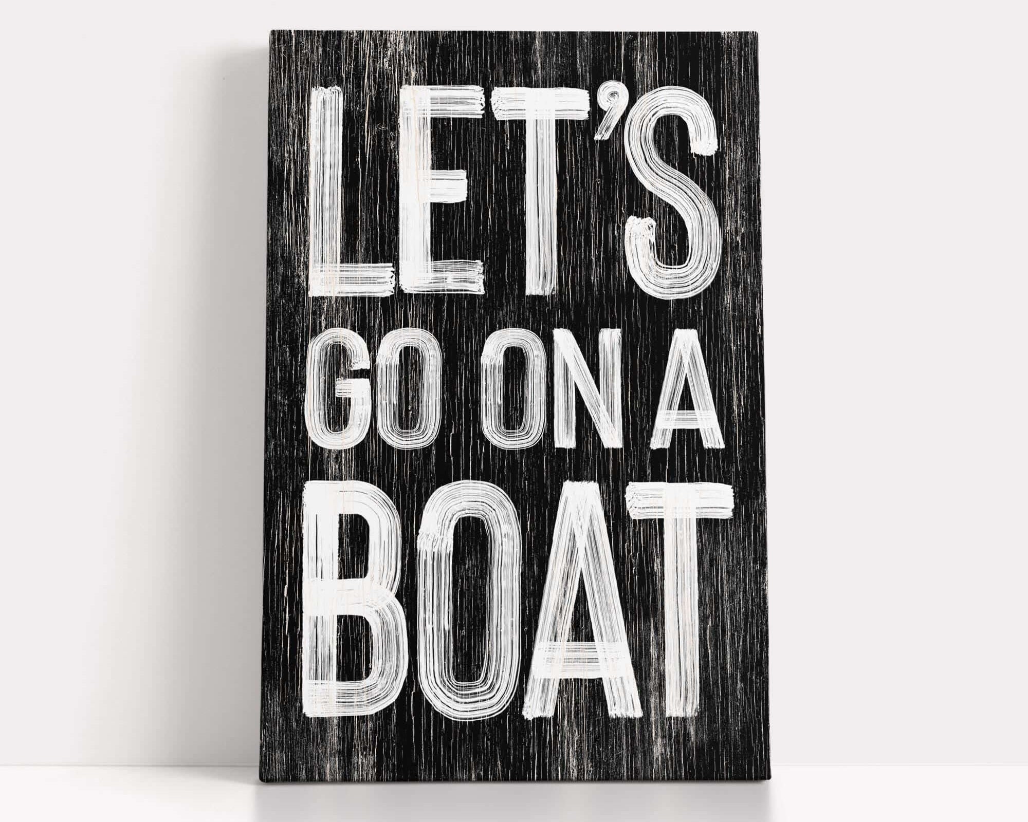 a wooden sign that says let's go on a boat