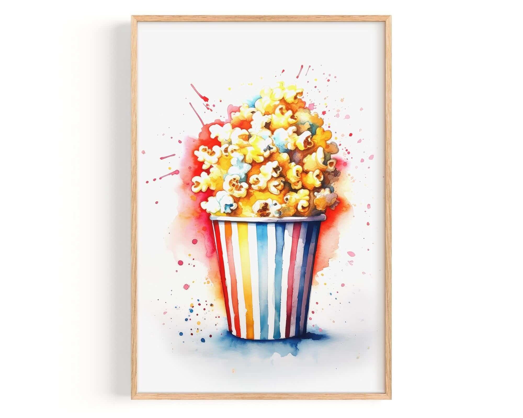 A framed watercolor painting depicting a colorful bucket filled with popcorn.