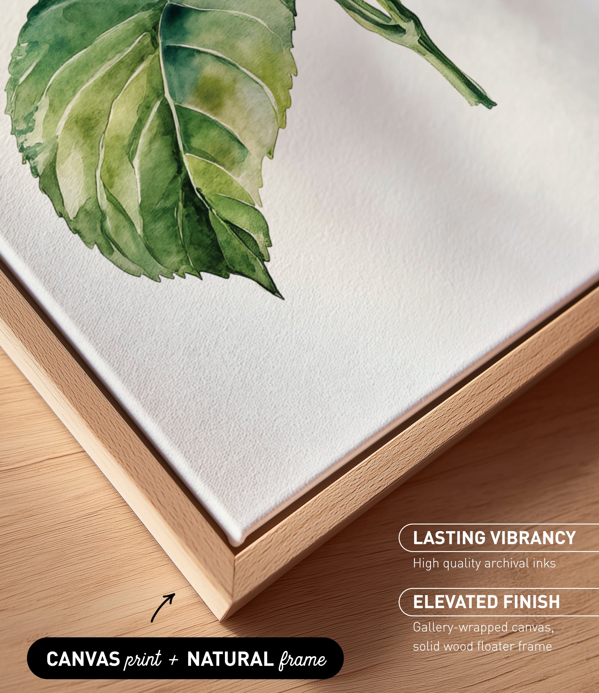 a close-up view of a watercolor painting of a green leaf on a white background. The painting is framed in a wooden frame, which adds a natural touch to the overall presentation.