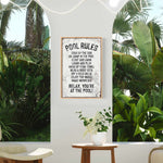 a picture of a room with plants and a sign
