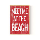 a red sign that says meet me at the beach