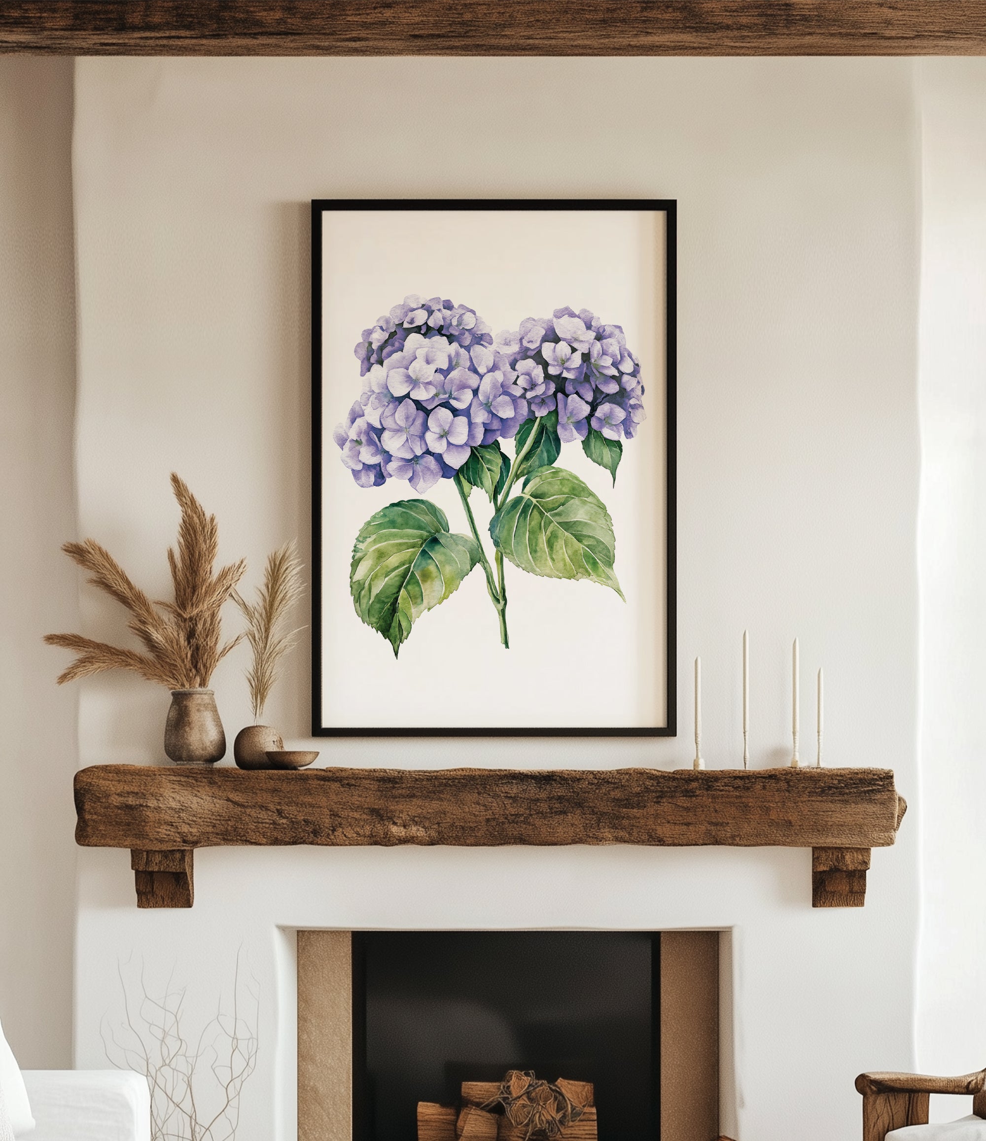 a framed watercolor painting of purple hydrangeas hanging on a white wall above a wooden mantel.