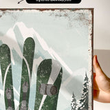 a person holding up a poster with skis on it