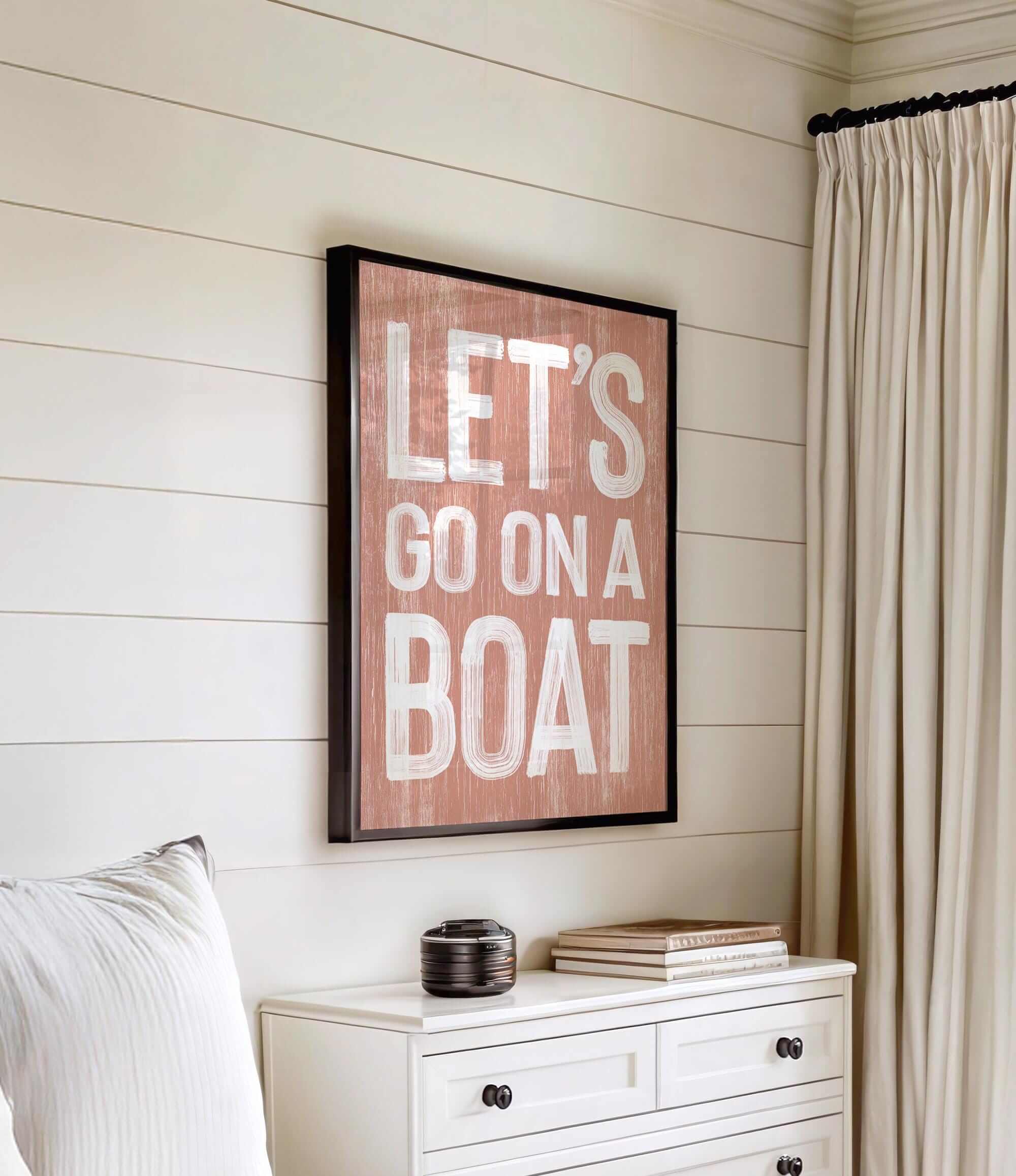 a bedroom with a bed, dresser and a painting on the wall
